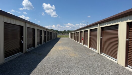 Row of drive-up storage units with brown doors