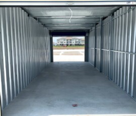 Inside an extra large drive-up storage unit for RVs, boats, cars, and vehicles