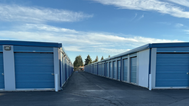 Row of drive-up storage units with blue doors