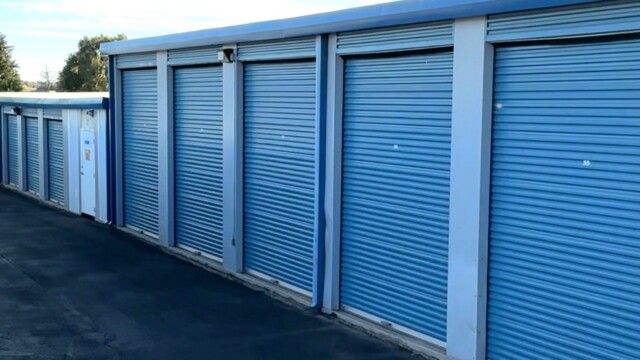 Drive-up self storage units with blue doors