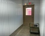 Hallway with climate-controlled storage units with moving dolly