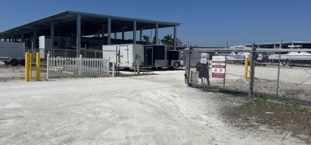 Covered vehicle storage behind the gated and fenced entrance