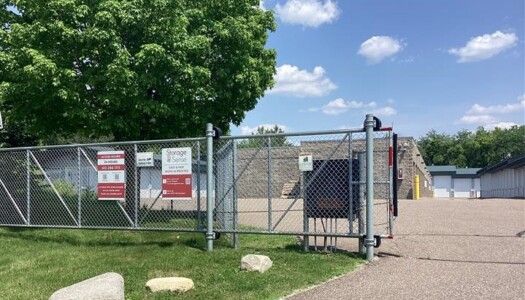 Entrance gate with drive-up storage units