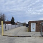 Entry gate to access drive-up and indoor storage units