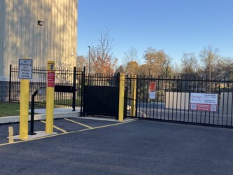 gated entrance to storage facility and drive-up units