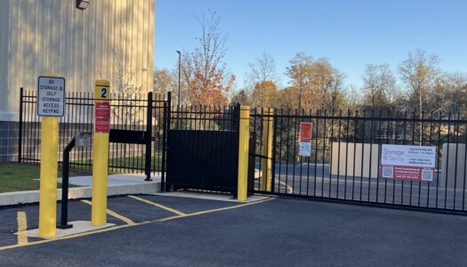 gated entrance to storage facility and drive-up units
