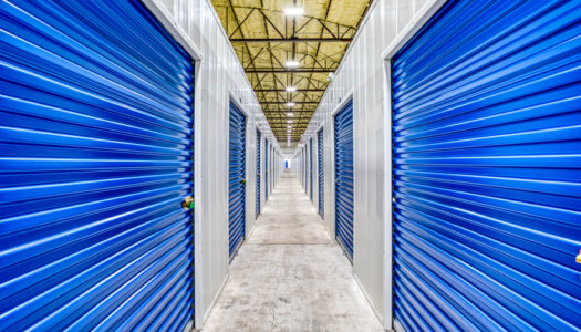 Hallway of indoor storage units with blue doors