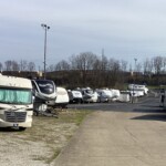 RV parking on one side of the aisle and the other side has drive-up storage-units