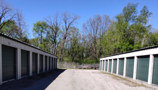Aisle of outdoor drive-up storage units