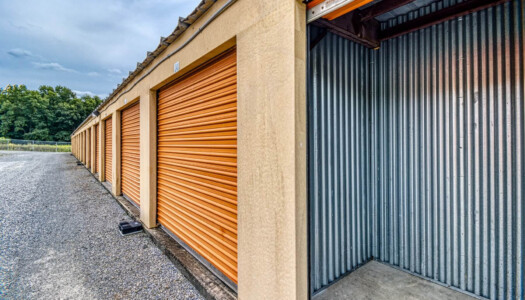 Row of storage units with one open