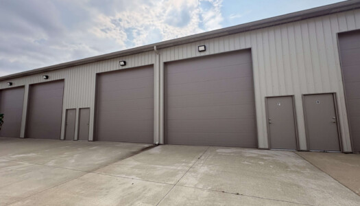 Gray metal storage facility with brown doors