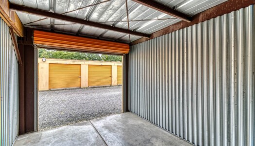 View from inside a storage unit looking out to other drive-up units
