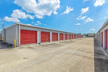 aisle of drive-up storage units at Storage Sense in Lake Charles, LA