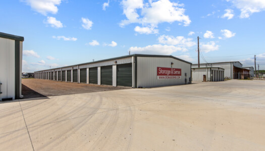 aisles of drive-up storage units at Storage Sense in Haslet, TX
