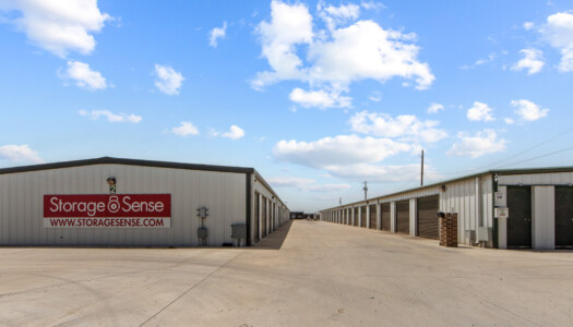 aisles of drive-up storage units at Storage Sense in Haslet, TX