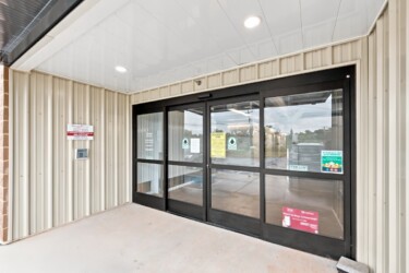 outside the office with keypad entrance to Storage Sense in Troutman, NC